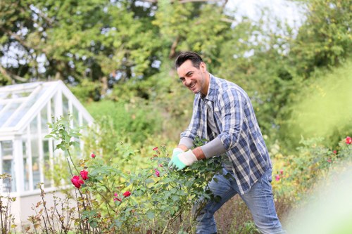 Garden maintenance work underway with clear service terms applied